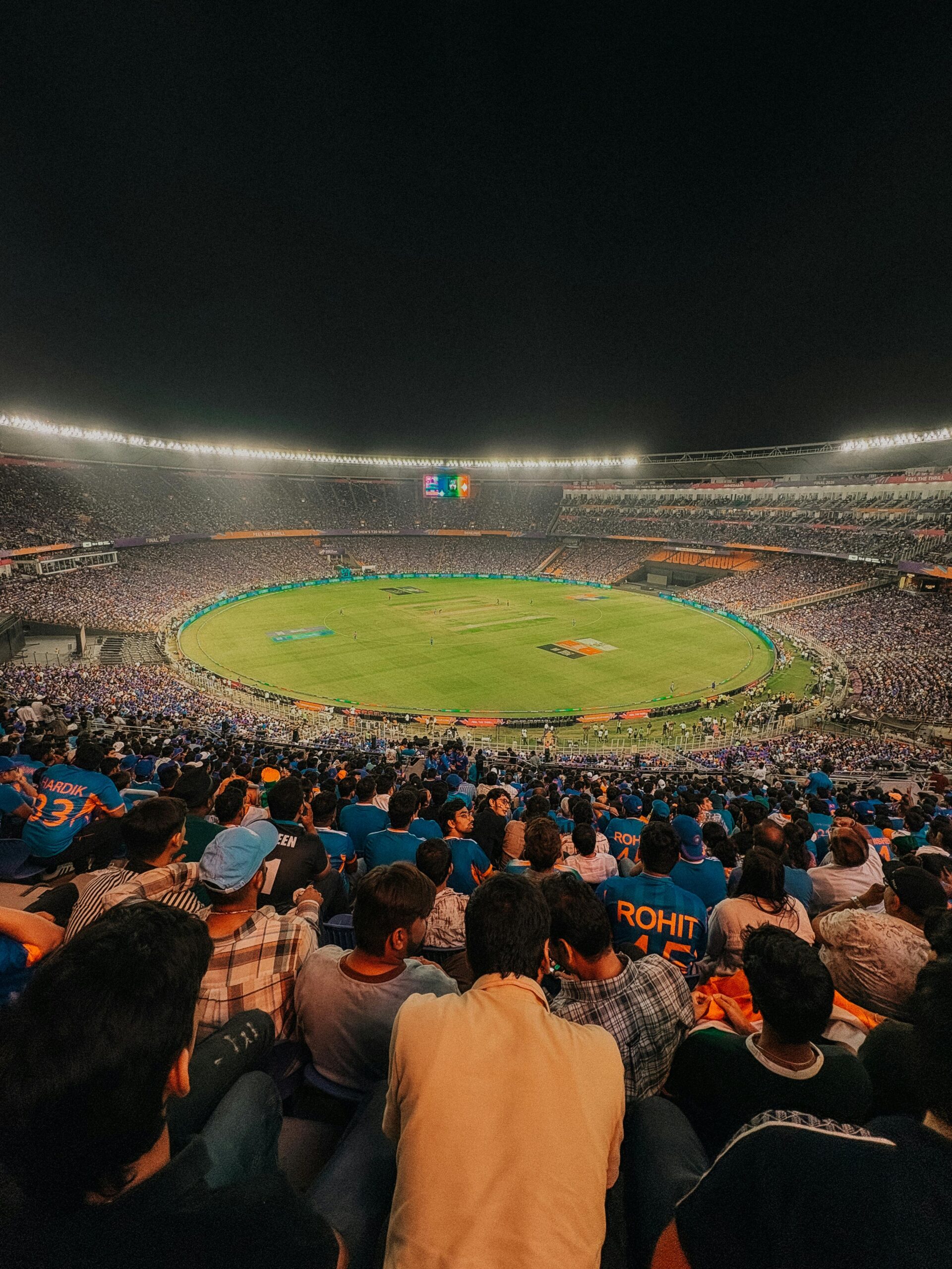 Packed stadium during a thrilling night cricket match in Ahmedabad, India.